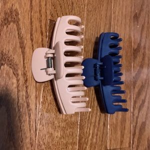 Two tan and navy claw clips